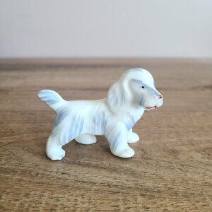 Vintage porcelain dog figurine. Japan.